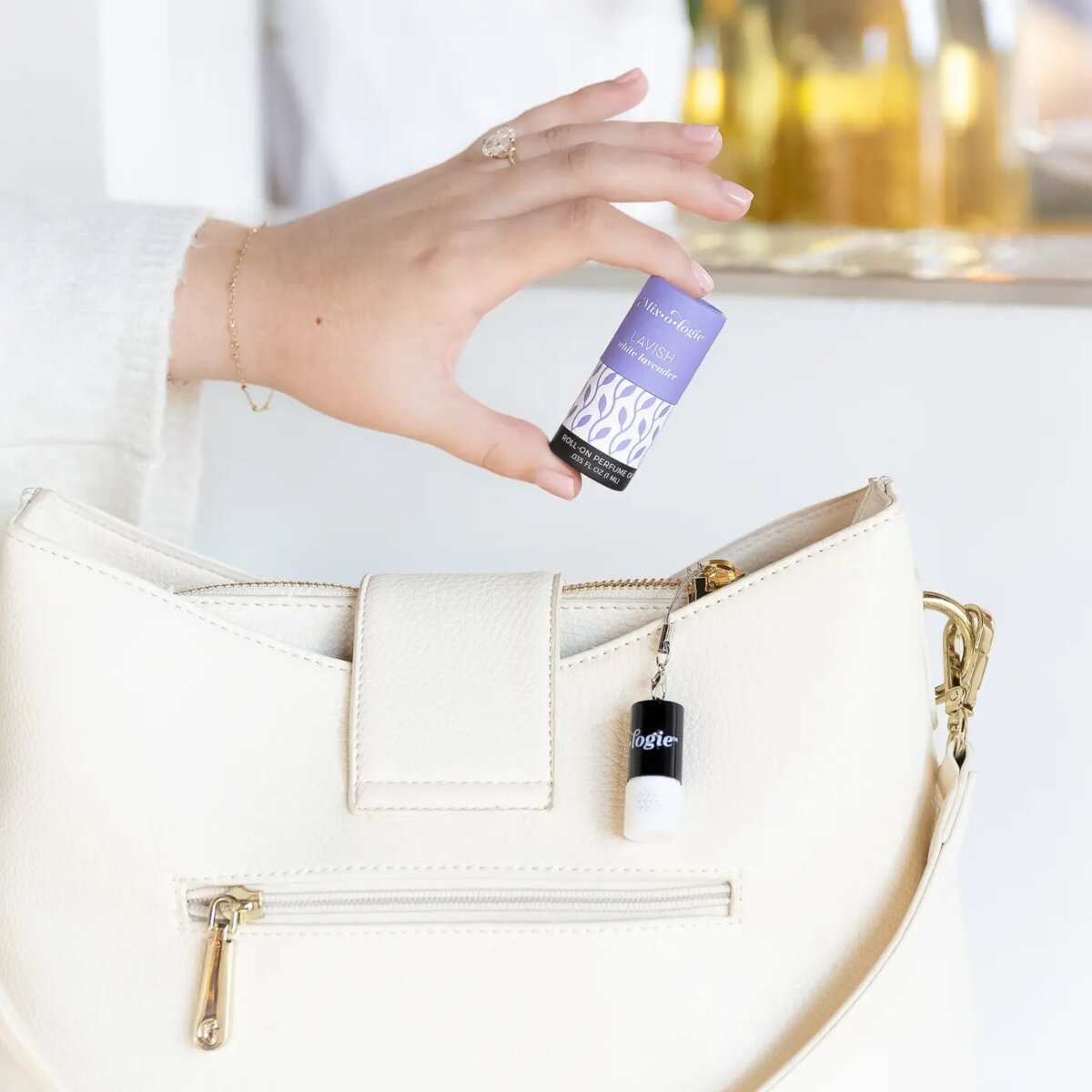 Downloaded from Shopify for use with Vendor ID (979) and Product ID (10288785916198). Product Image for  Lavish (White Lavender) | Keychain Mini Roll-On Perfume